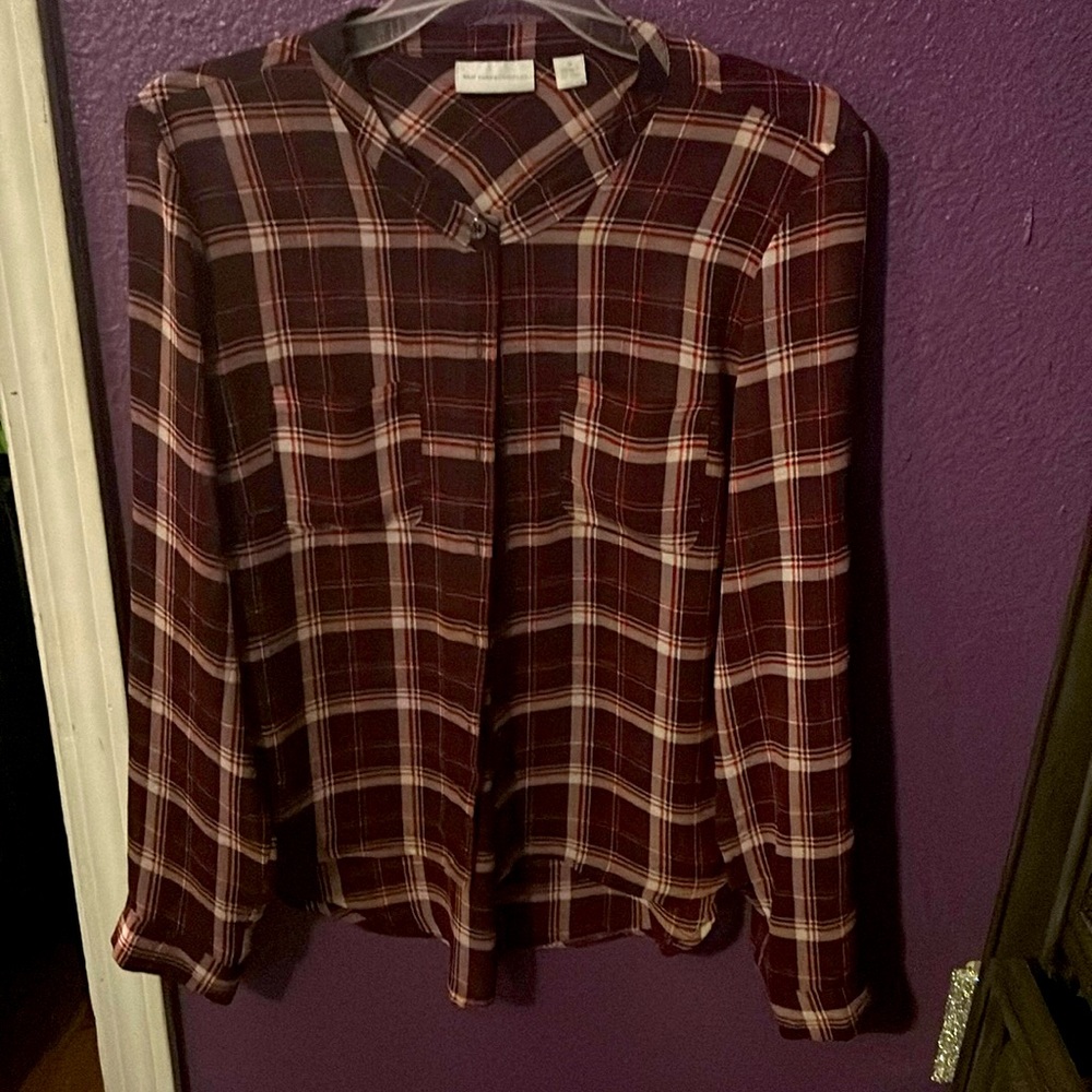 It is a New York company top size medium colors are red burgundy and white